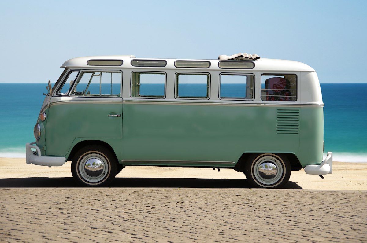 Convertible campervan on a sandy beach